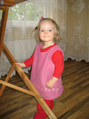 Standing over there, smiling