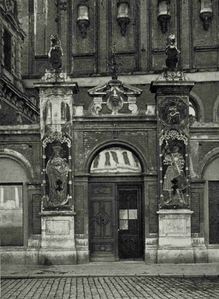 Entrance to The Hall of The Blackheads (see text, page 401) : RIGABefore the door are the figures of the Virgin Mary and Saint Maurice, while Saint George perches on its roof-tree and King Arthur on its clock. Upstairs in the Schwarzhaupterhaus, as it is familiarly called, there is an assembly hall walled in by expansive pictures of the former great. A windowless room in the basement houses the shield, boots, stirrups, and mail shirt of Gustavus Adolphus, a blue satin slipper of Anne, Duchess of Courland from 1711 to 1730, who evidently captured the fancy of these imperturbable bachelors, and numerous other relics.Photograph by Carl Schneider