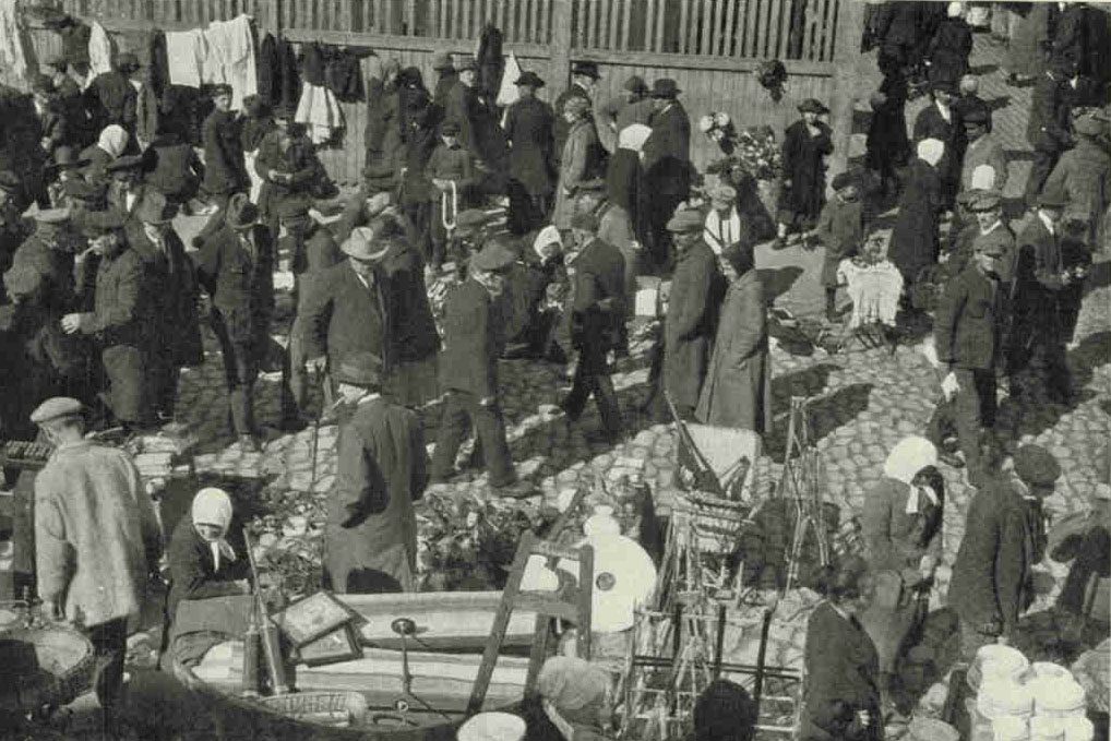 A Corner of The Flea Market in The Moscow Suburb of RigaFrom one end of prewar Russia to the other the sale of second-hand odds and ends, held usually in the street, is highly popular and is still counted on by the poor to provide the things that might be bought for a fraction more in a regular shop. These are sometimes spoken of as thieves' market (see text, page 418)Photograph by Maynard Owen Williams