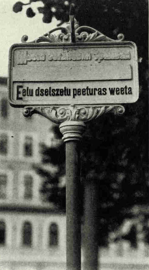 A "Car-stop" Sign in RigaUnder the Russians, Riga was admittedly a trilingual city. This sign originally had words in Russian at the top, in German in the middle, and in Lettish at the bottom. The Letts have painted over the Russian, fastened a bar of iron over the German, and left Lettish as the only guide (see text, page 415).Photograph by Maynard Owen Williams