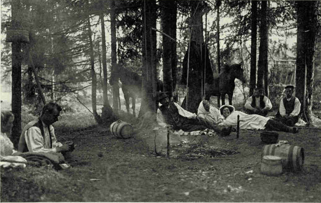 A Little Rest in A Latvian WoodDuring the four months of spring and summer the peasants work from 4 in the morning until 7, when they have breakfast. Work after breakfast, work alter luncheon, and work after the evening meal is their continuous program while the crops are growing. In the winter there are repairs to be made and threshing, weaving, and spinning to be done.Photograph by J. Reeksta