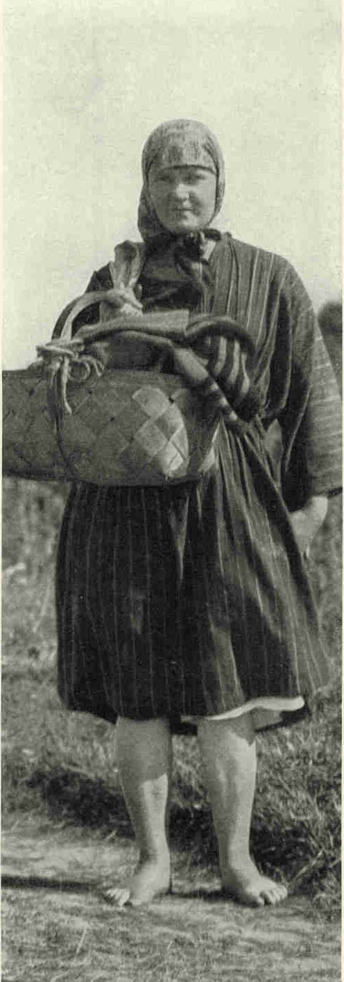 A Young Latvian Woman of JelgavaIn the labor of Latvia there is neither age nor sex line. Children assume definite duties at the age of seven, and old women stagger into the towns under heavy loads of toil in water to rescue swamp grass for hay.Photograph by Maynard Owen Williams
