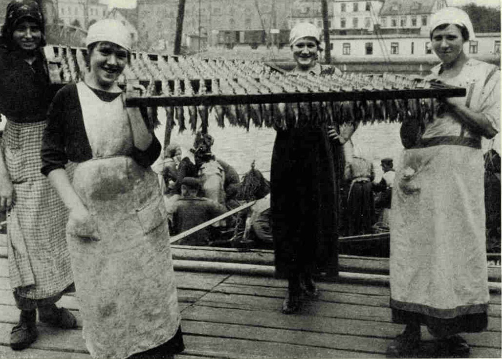 Latvian Girls of Liepaja (Libau) Carrying Home The Day's CatchA species of sea trout, which closely resembles the salmon and is often mistaken for it, is found in abundance in Latvian waters. Whitefish of some of the coarser varieties and herring are also plentiful. Quantities of preserved fish are exported.Photograph by Ernest Peterfly