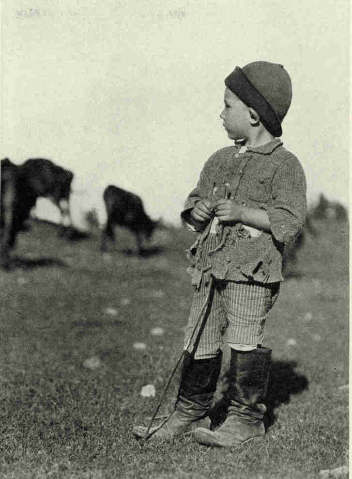 He Expects to Grow Up in His Father's FootstepsThe life of the child in Latvia is seldom carefree or joyous. The sullen, heavy weather keeps him from romping in the open and at a very early age he must assume duties in the field or take care of the cattle.Photograph by Maynard Owen Williams